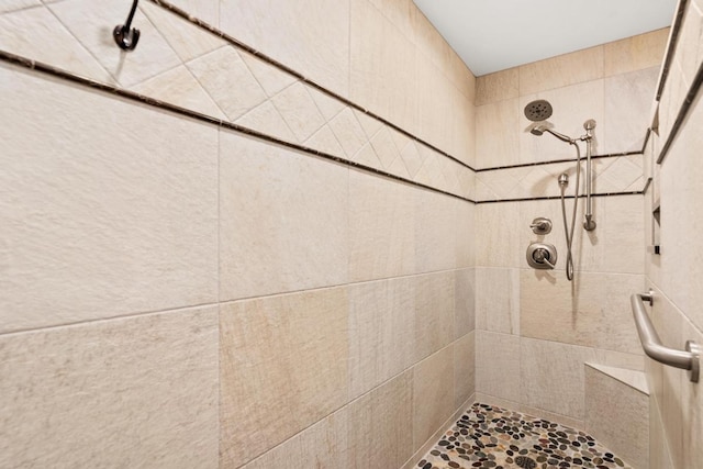 bathroom featuring tiled shower