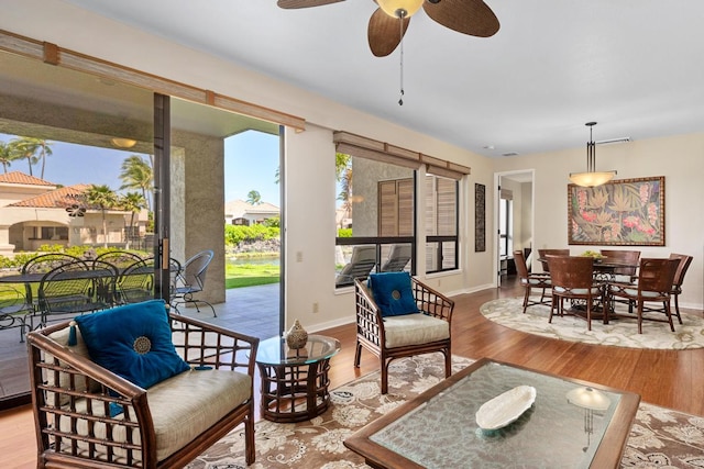 interior space featuring hardwood / wood-style flooring and ceiling fan