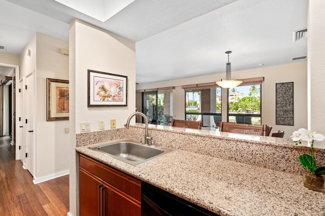 69-1035 Keana Pl Unit 113, Waikoloa, HI 96738 - kitchen featuring a sink, wood finished floors, baseboards, pendant lighting, and light stone countertops