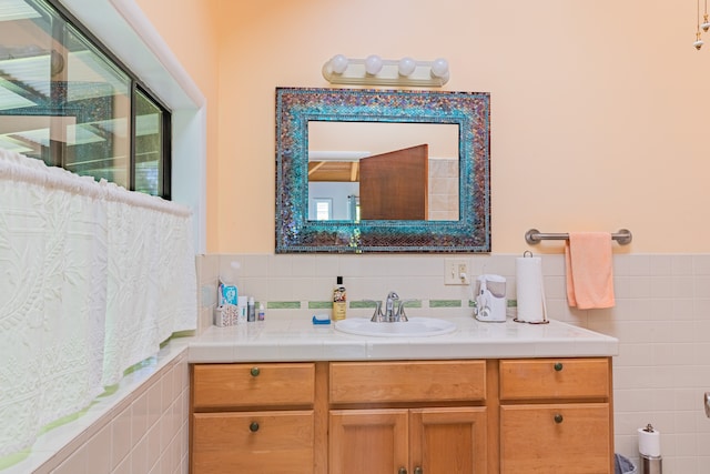 bathroom featuring vanity and a healthy amount of sunlight