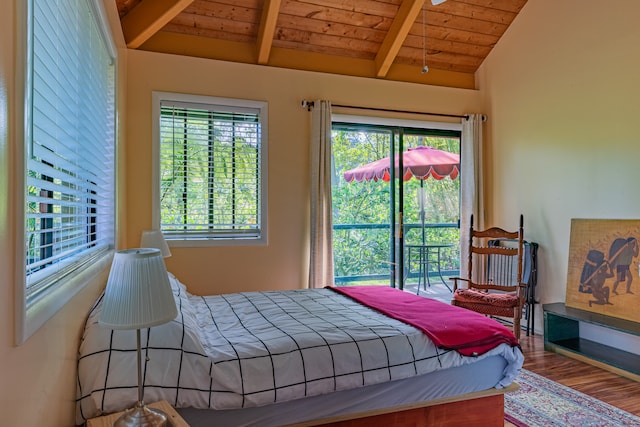 bedroom with lofted ceiling with beams, wood ceiling, and wood-type flooring