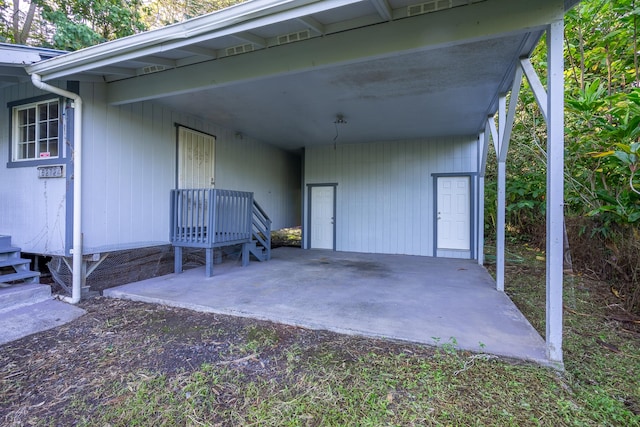 exterior space with a carport