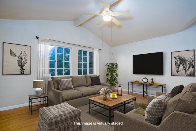 living room with ceiling fan, light hardwood / wood-style flooring, and lofted ceiling with beams