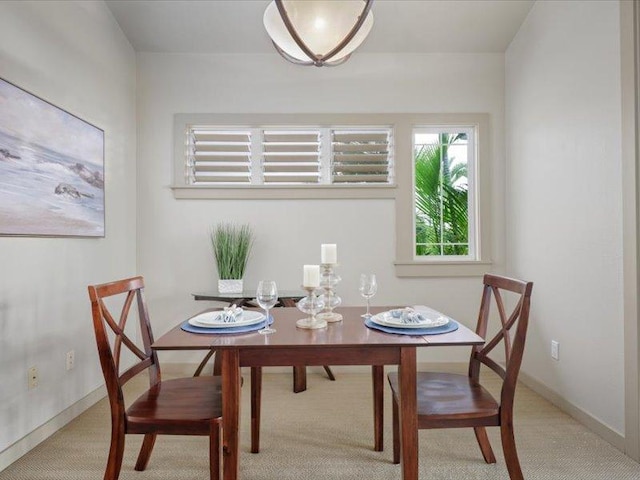 dining room with baseboards