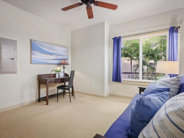 bedroom featuring electric panel, ceiling fan, light carpet, and baseboards