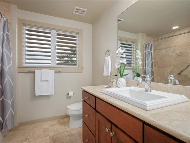 full bathroom with visible vents, toilet, vanity, baseboards, and tile patterned floors