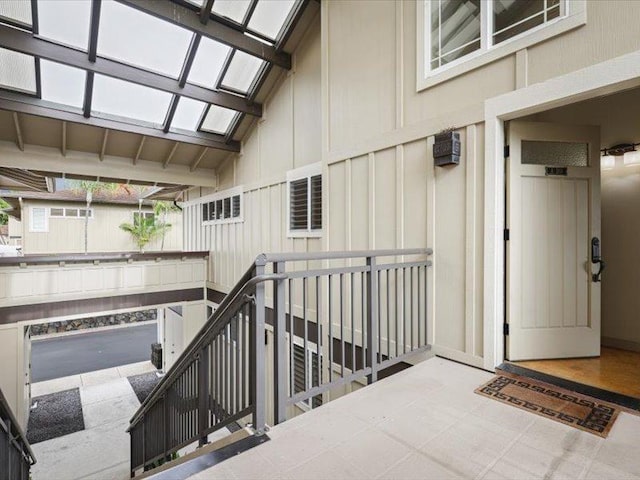 view of exterior entry featuring board and batten siding