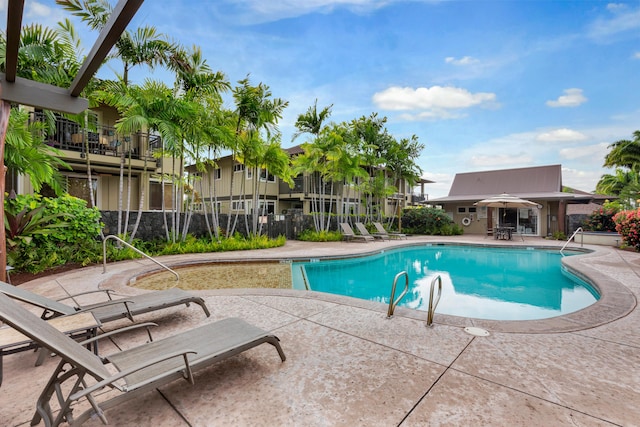 pool featuring a patio area