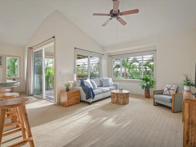 sunroom featuring lofted ceiling and ceiling fan