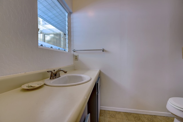 bathroom with vanity and toilet