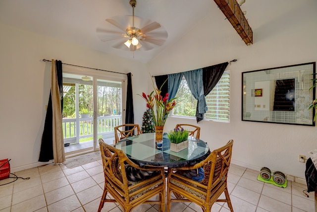 dining space with light tile patterned floors, lofted ceiling, a wealth of natural light, and ceiling fan