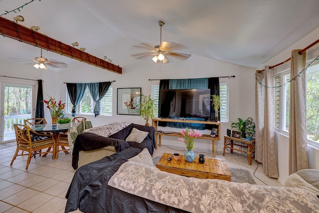 tiled living room featuring ceiling fan and vaulted ceiling