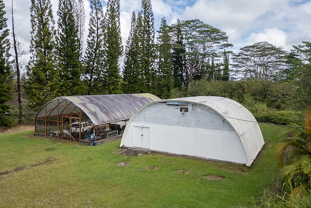 view of outdoor structure featuring a yard