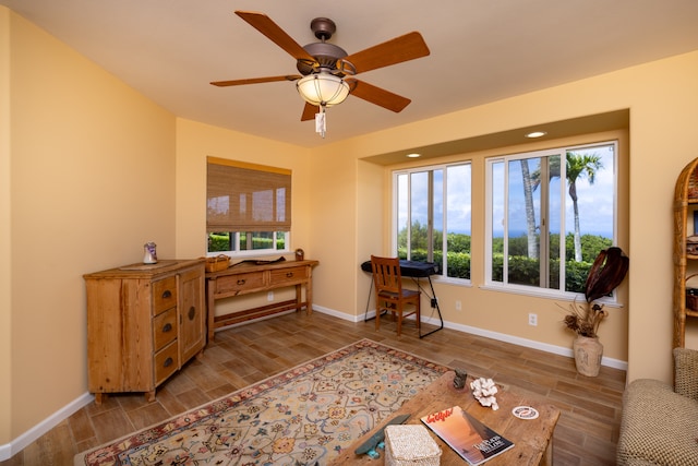 sitting room featuring ceiling fan and hardwood / wood-style floors