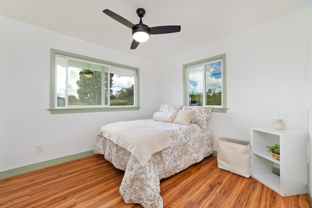 bedroom featuring hardwood / wood-style floors and ceiling fan