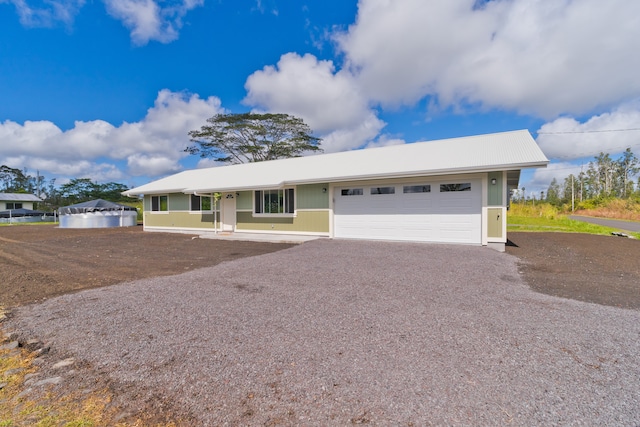 ranch-style home with a garage