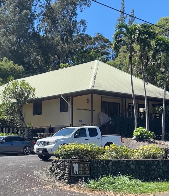 view of property exterior with a porch