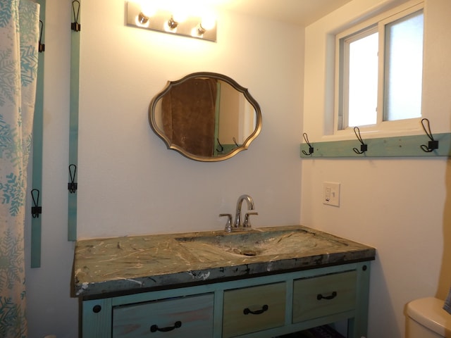 bathroom with vanity and toilet