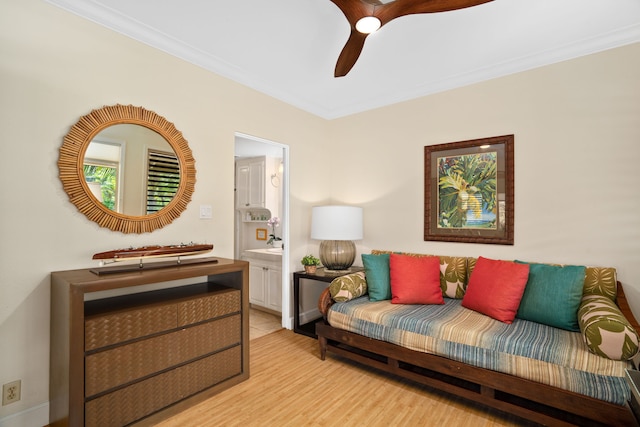 sitting room featuring ceiling fan, light hardwood / wood-style flooring, and crown molding