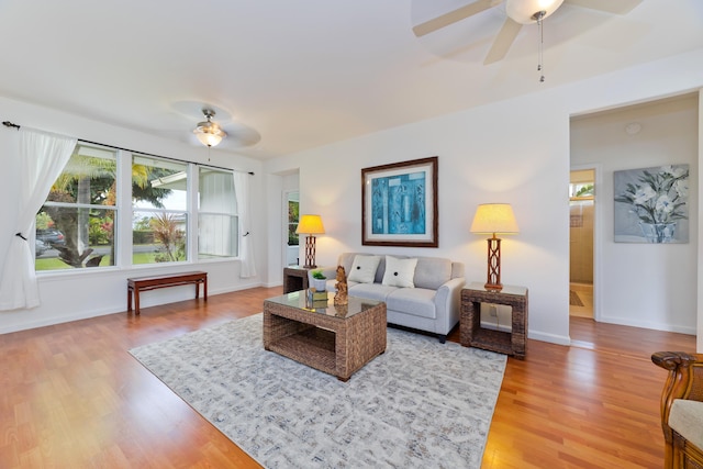 living room with hardwood / wood-style flooring and ceiling fan