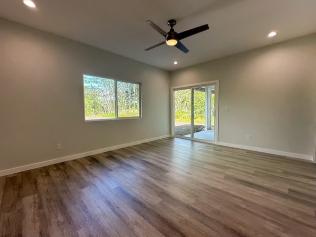 empty room featuring ceiling fan and wood-type flooring