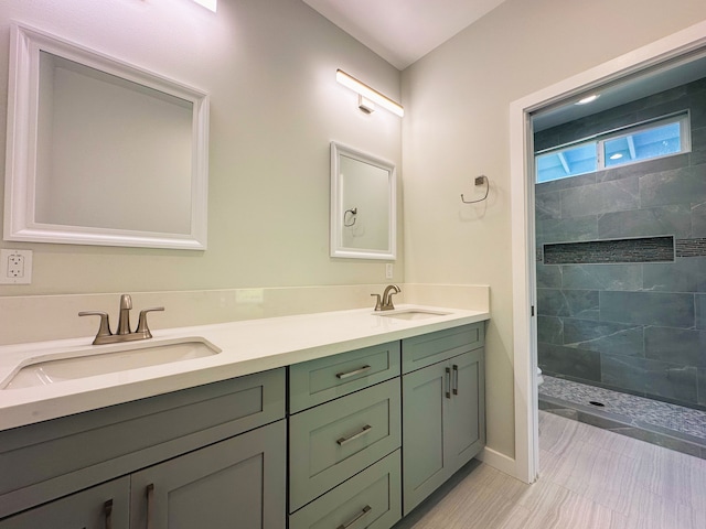 bathroom with vanity, toilet, and a tile shower