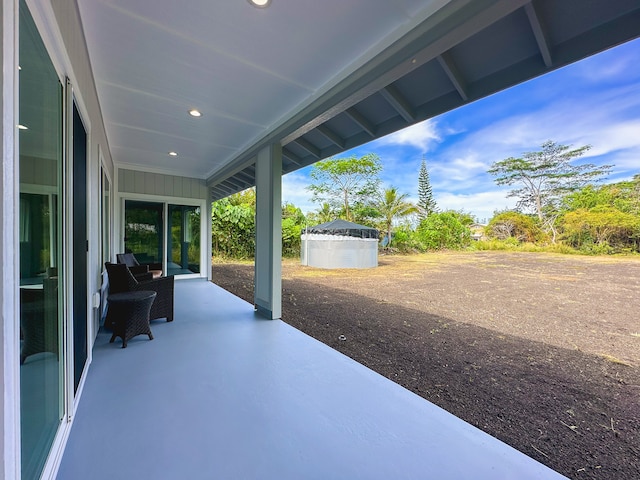 view of patio / terrace with a shed