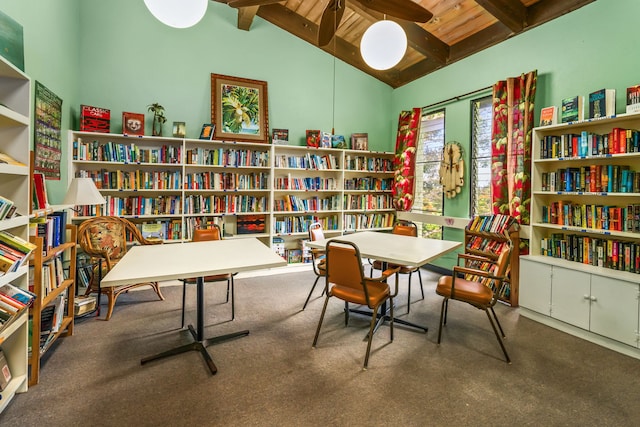 interior space with lofted ceiling with beams, carpet flooring, and wooden ceiling