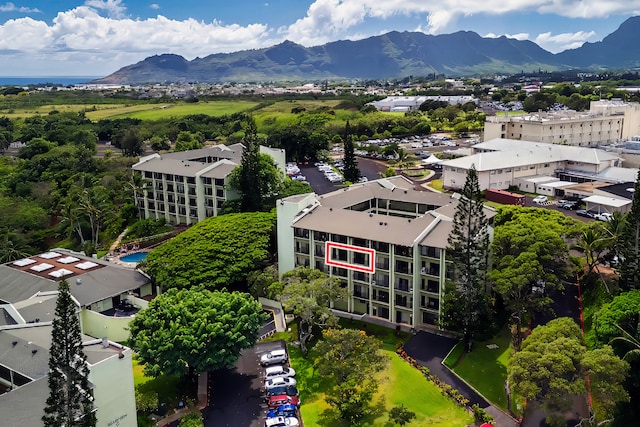 birds eye view of property featuring a mountain view