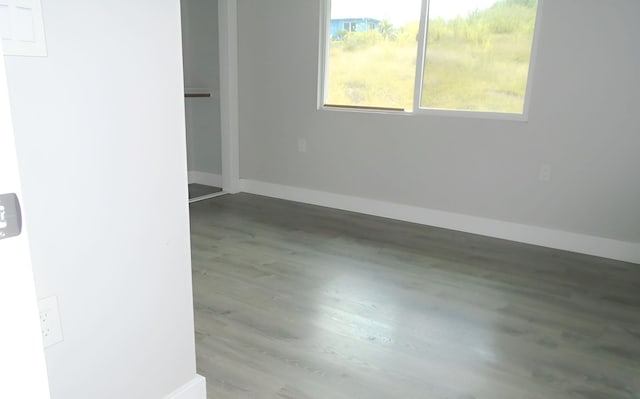 spare room featuring hardwood / wood-style floors