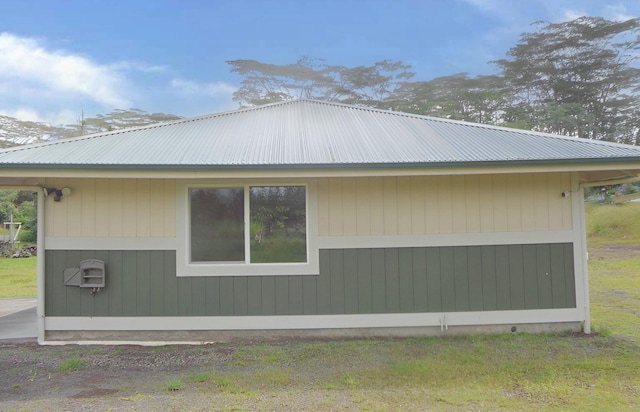 view of home's exterior featuring metal roof