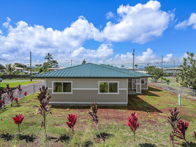 view of home's exterior with a yard