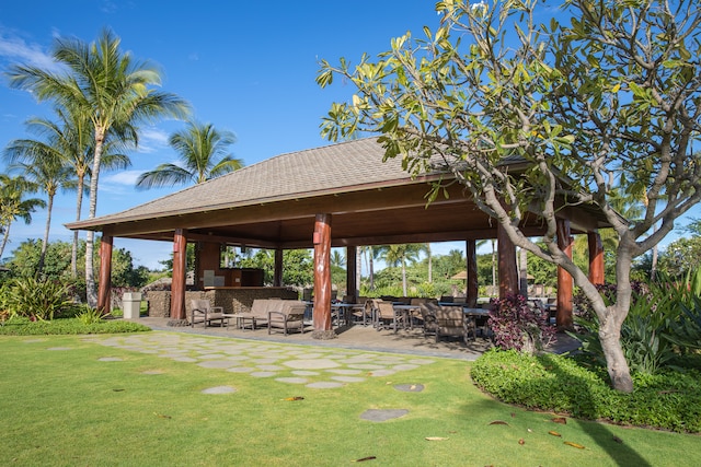 surrounding community with a yard, a gazebo, a patio area, and outdoor lounge area