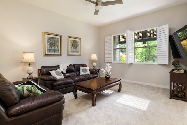 living room with light colored carpet and ceiling fan