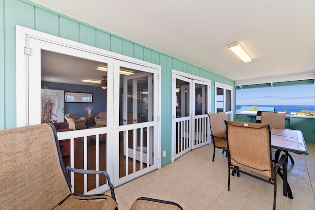 sunroom with a water view