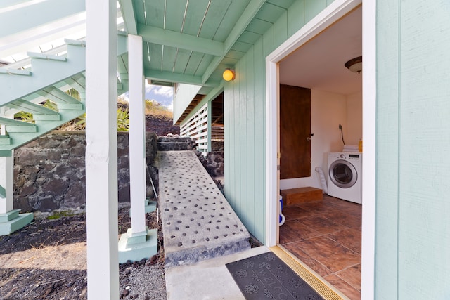 view of exterior entry with washer / dryer