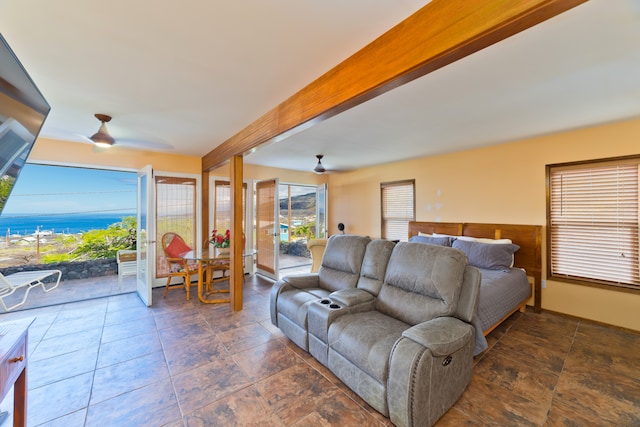 living room featuring beam ceiling and ceiling fan