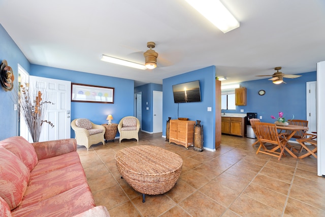 living room with light tile patterned floors and ceiling fan