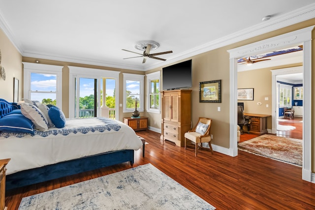 bedroom with ornamental molding, dark hardwood / wood-style floors, and ceiling fan