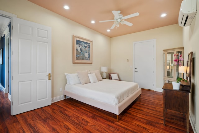 bedroom featuring a wall unit AC, ceiling fan, and dark hardwood / wood-style flooring