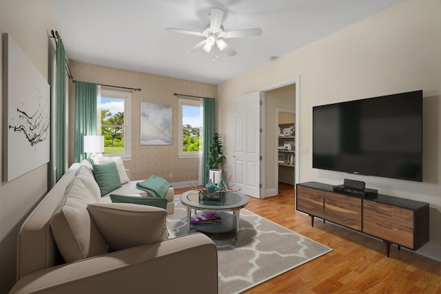 living room with light hardwood / wood-style floors and ceiling fan