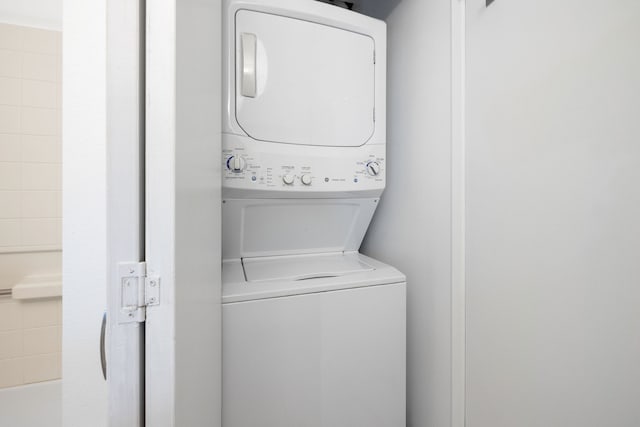 laundry room with stacked washer and clothes dryer