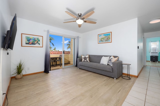 living room with ceiling fan and light hardwood / wood-style floors