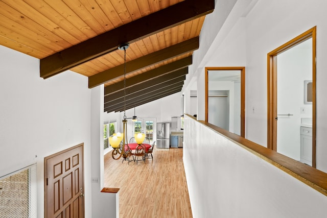 hallway featuring high vaulted ceiling, hardwood / wood-style flooring, beamed ceiling, and wooden ceiling