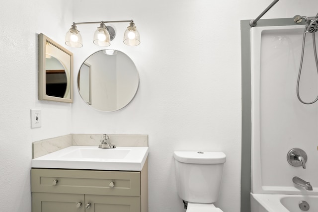 full bathroom with vanity, toilet, and  shower combination