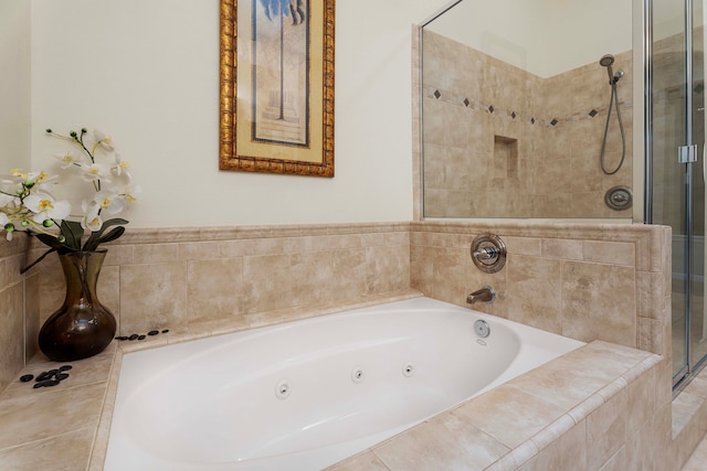 bathroom featuring shower with separate bathtub