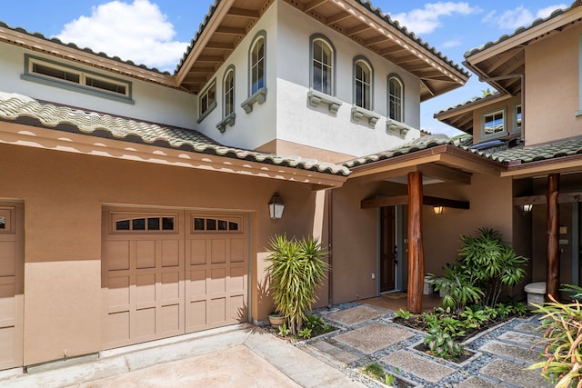 mediterranean / spanish home featuring a garage