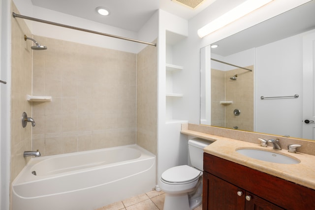 full bathroom with vanity, toilet, tile patterned flooring, and tiled shower / bath