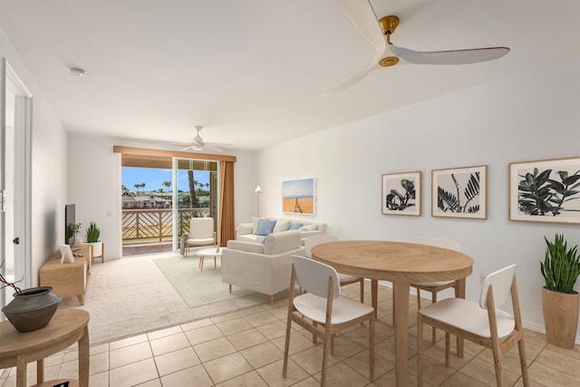 dining area featuring light tile patterned flooring and ceiling fan