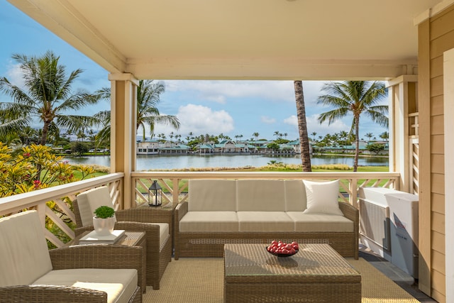 exterior space featuring an outdoor living space and a water view